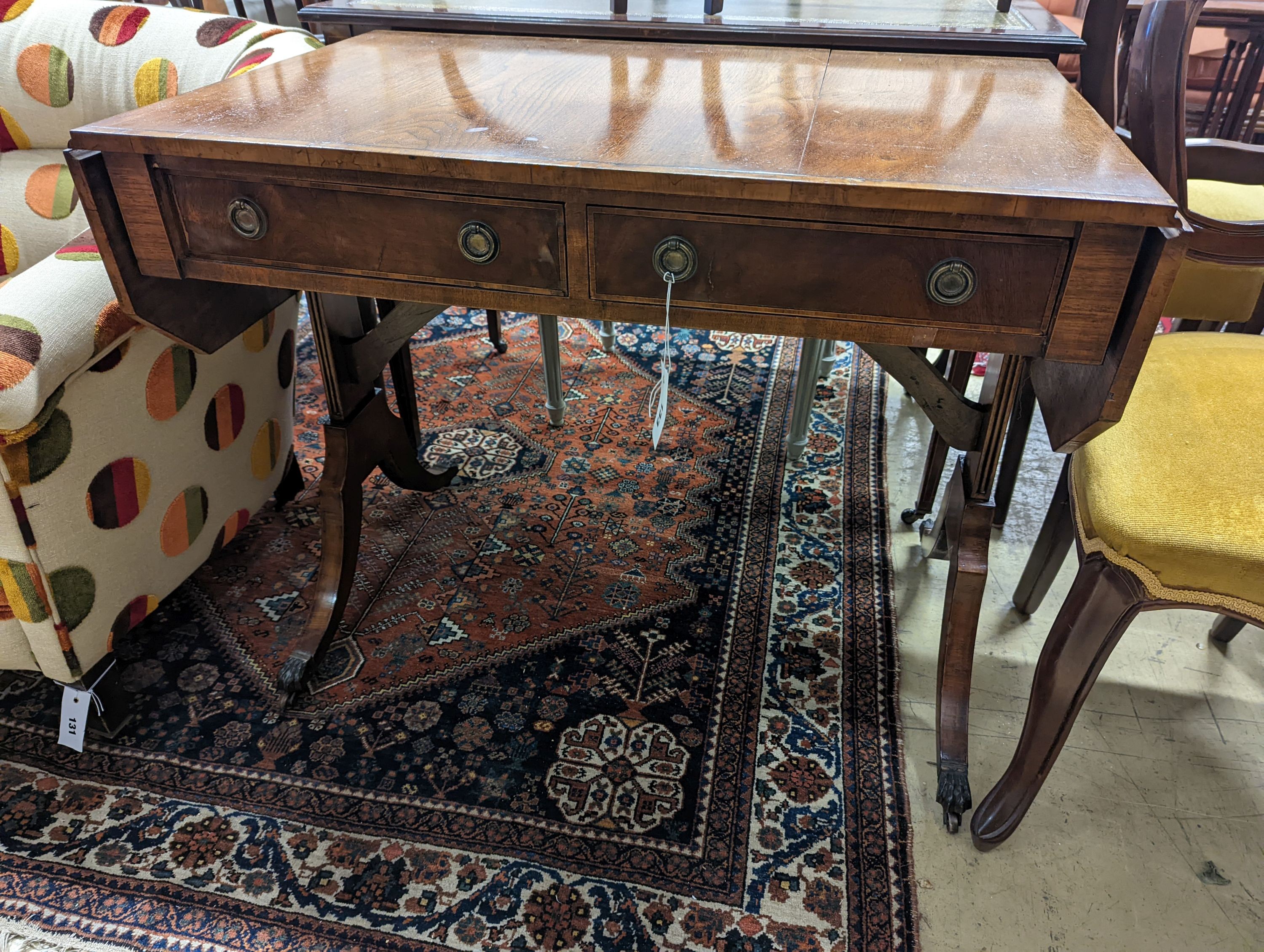 A Regency style banded mahogany sofa table, width 86cm, depth 56cm, height 72cm